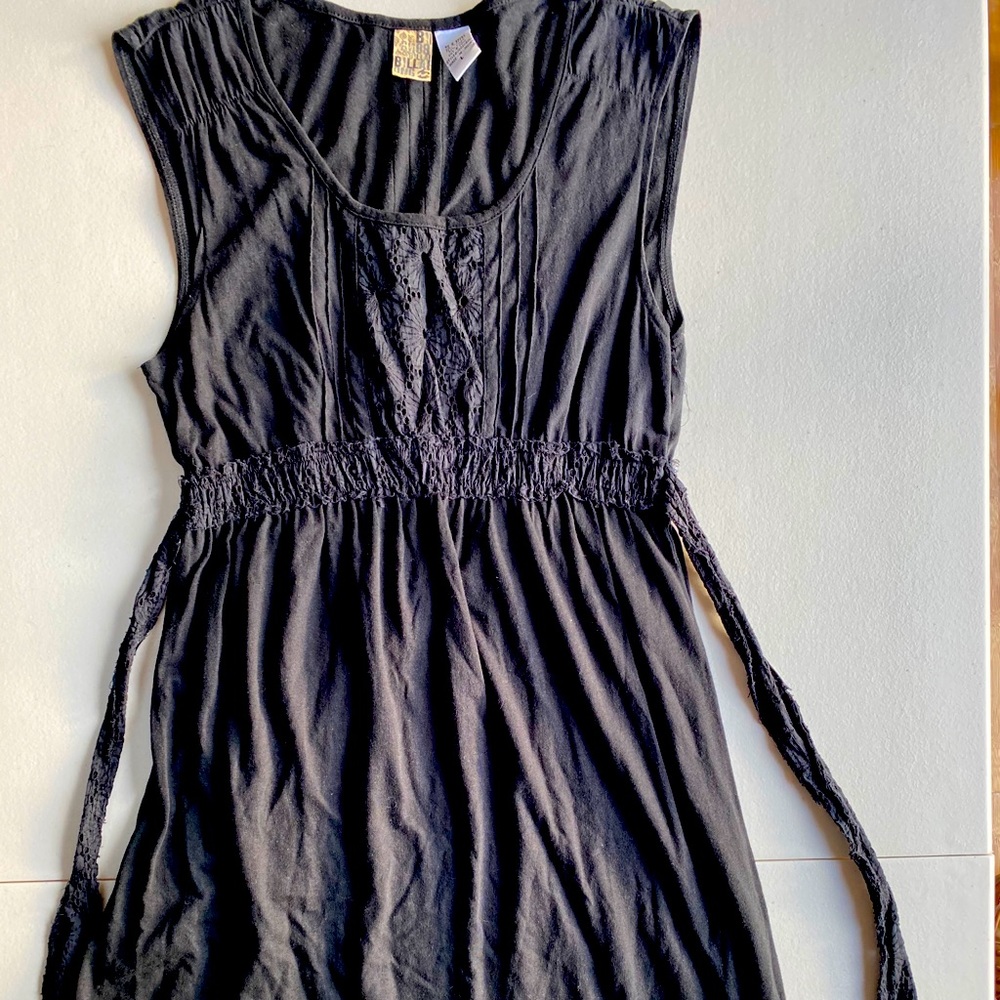Black sleeveless dress.